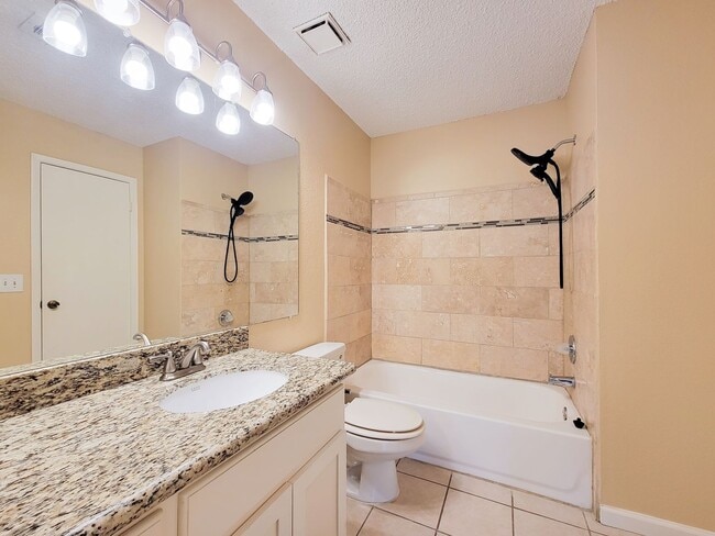 Building Photo - Welcome to This Charming Townhome Nestled ...