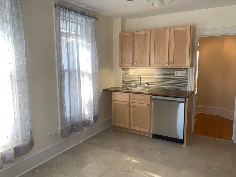 Brand new dishwasher, sink, backsplash, and flooring-- plus new paint! - 2645 Colfax Ave S
