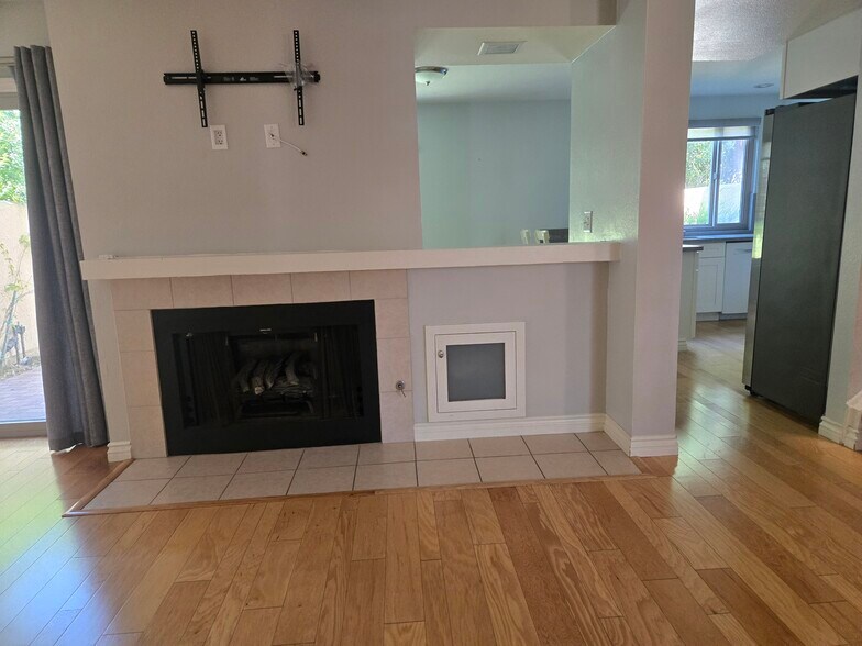 living room with tv mount built in - 8830 Via Andar