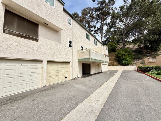 Building Photo - Move in Ready! 2BD Townhome! New Carpet! Two Patio Spaces! Attached Garage!