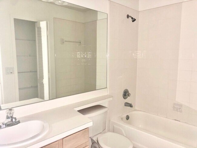 Building Photo - Nice 2X2 located on 2nd floor- Tile & lami...
