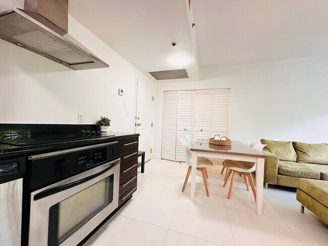 Building Photo - Bright and furnished 1/1 in classy remodel...