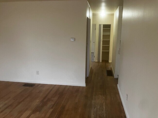 Building Photo - Charming 3BR Home with Beautiful Wood Floors