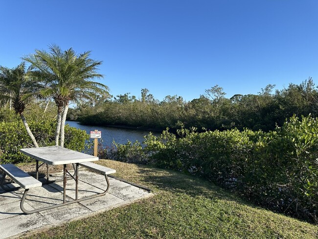 Building Photo - "Charming Waterfront Condo Retreat: Fully ...