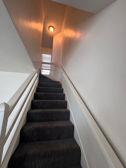 Stairs to bedrooms and bath. - 424 W Riggin St