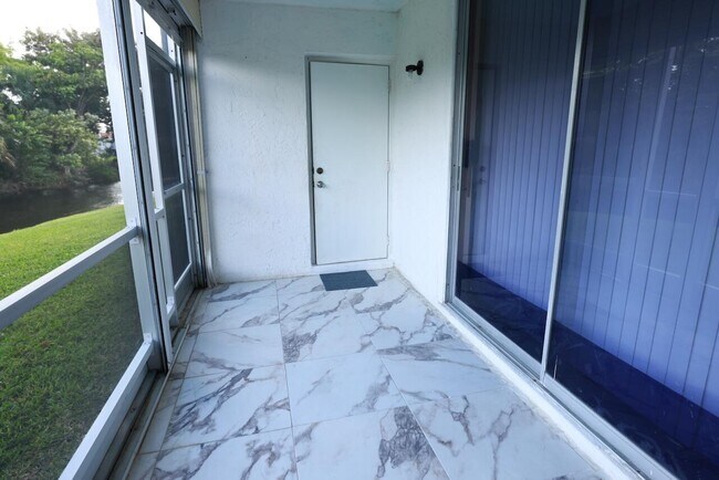 Building Photo - 6570 Royal Palm Blvd