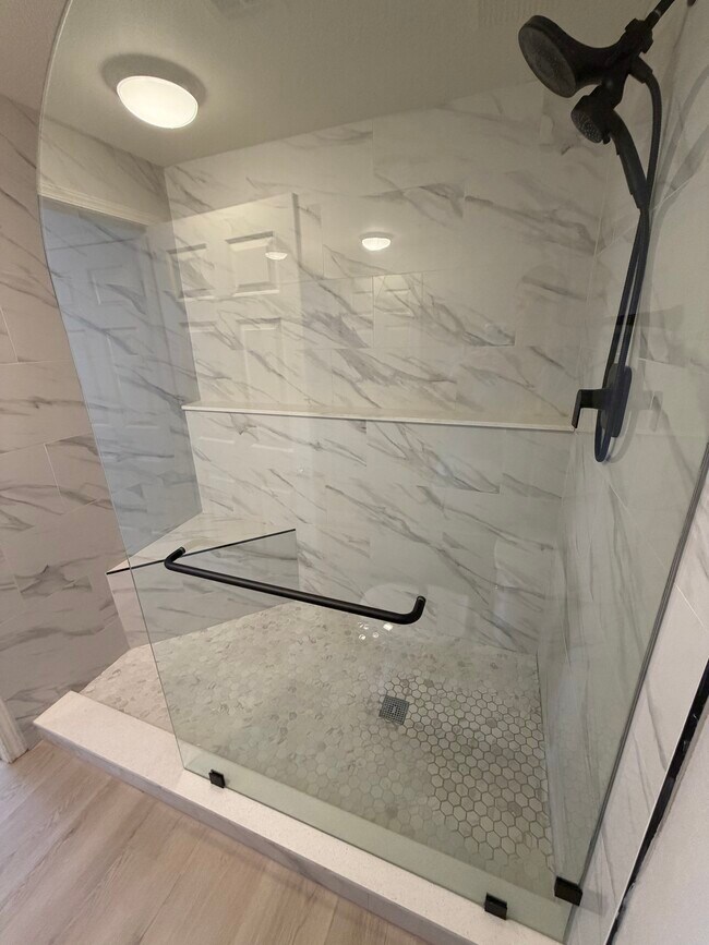 new walk in shower with dual heads and built in shower bench - 231 W Horizon Ridge Pky