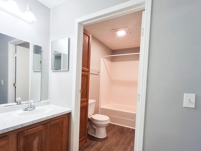 Building Photo - 4 Bed / 2 Full Bath House on a Quiet Dead-End Street — Attached Garage, Central A/C, W/D Hookups ...
