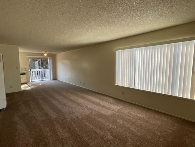 Building Photo - Large Upstairs 2-Bedroom with New Carpet & On-Site Laundry