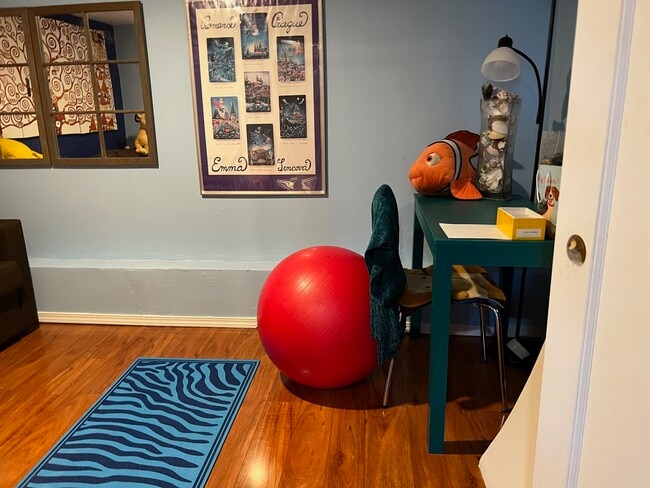 The study with desk, chair and quean size sofa bed - 1627 15th Ave