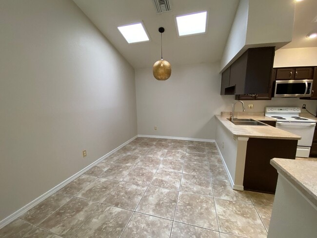 Building Photo - Quaint Retreat: 2BR/2BA Haven with Private Yard, Vaulted Ceilings & Cozy Fireplace