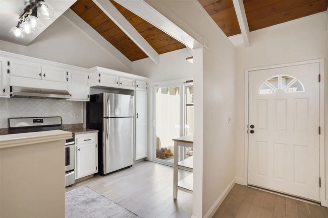 Building Photo - Spacious 1,550 Sq Ft Townhome | 2-Car Garage & High Ceilings w/ Exposed Beams