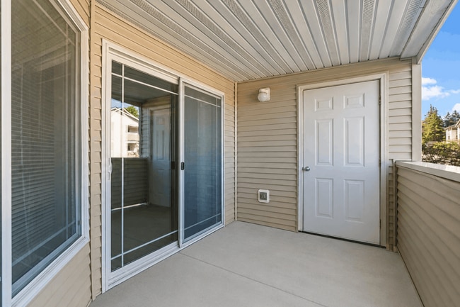 Enjoy fresh air and extra storage from your private patio. - Villas at Lawrence