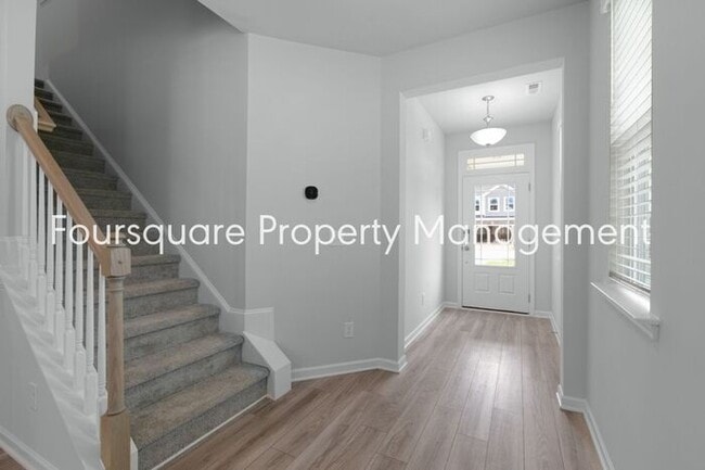 Building Photo - Bright 3-Bed 2.5-Bath End-Unit Townhome with Washer/ Dryer, Granite Kitchen & 2-Car Garage.Conven...