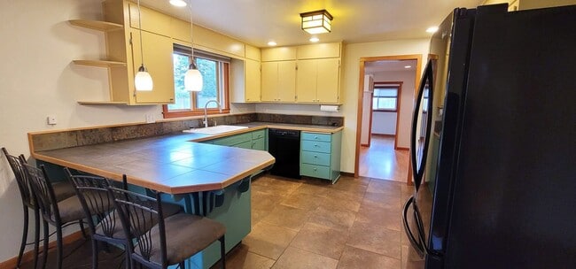 Building Photo - Gorgeous 4-bedroom home including a Two Car Garage and Spacious Backyard with a Shaded Patio