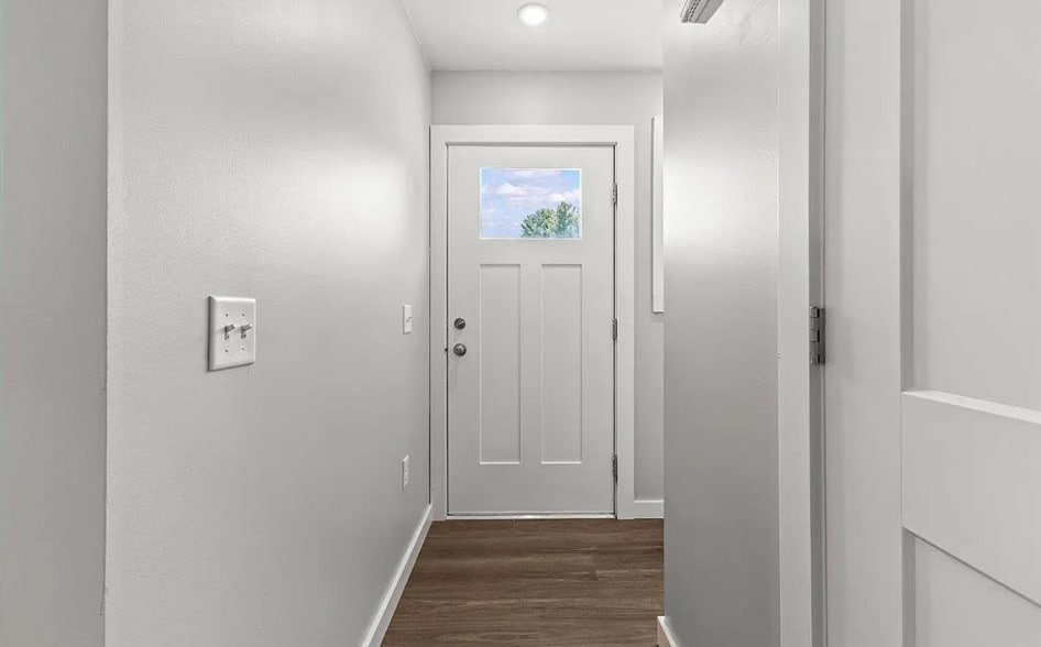 The entryway is bright and inviting, with a small mudroom/coatroom space. - 24 Wilsons End Pl