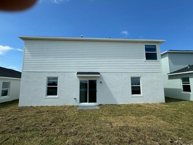 Building Photo - 10856 NW Everbreeze Dr