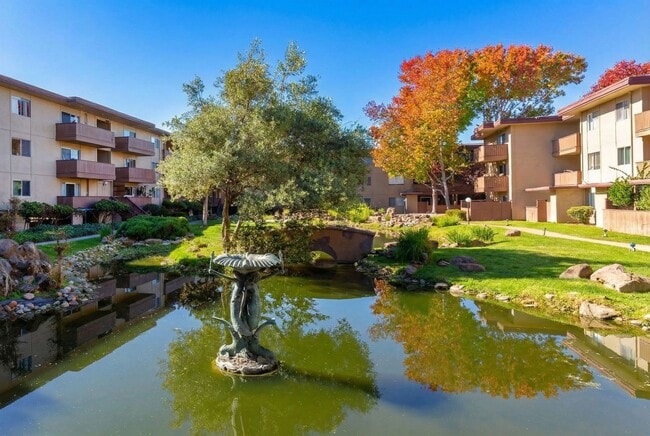 Building Photo - Modern 2-Bedroom Condo with Pool and Koi Pond Views