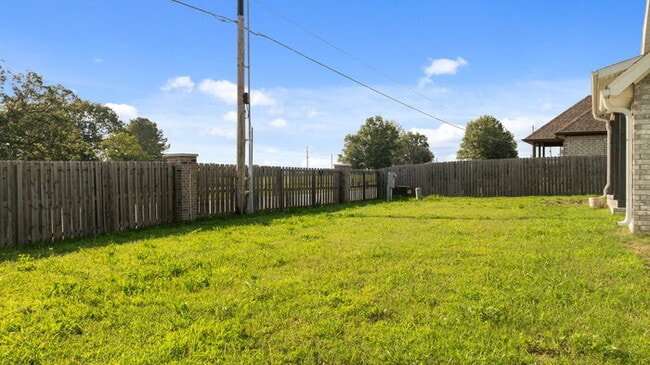 Building Photo - "Lovely 4-Bedroom Retreat with Fireplace &...