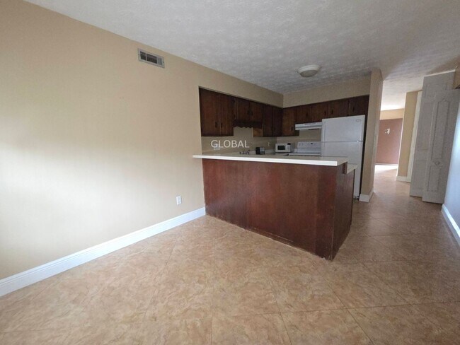 Building Photo - Lakefront First-Floor Condo in Camelot by ...