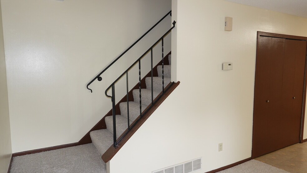 stairs to second level - 1610 Helena Rd N