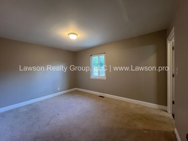 Building Photo - Charming Brick Ranch with Beautifully Landscaped Yard and Attached Carport