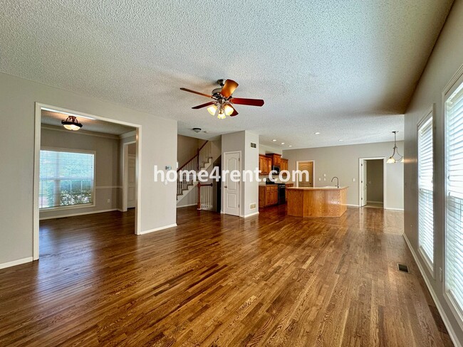 Building Photo - Beautiful Four-Bedroom Home with Three Car Garage, Wood Floors, Finished Basement and a Fenced Ya...