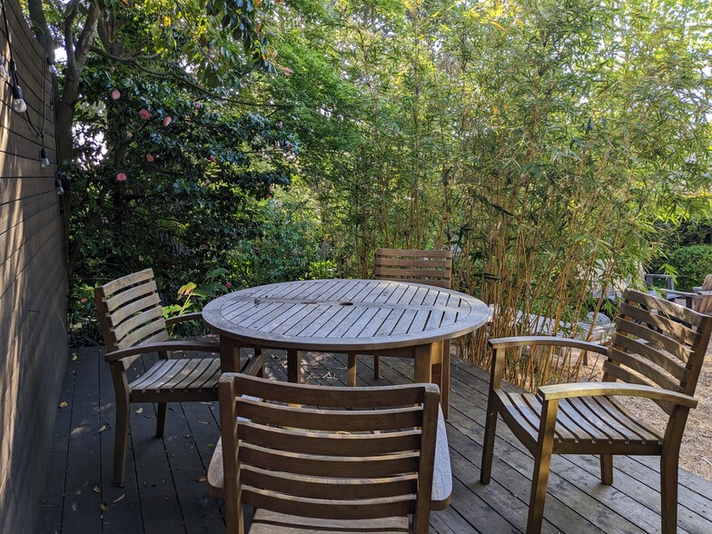 Private deck is surrounded by bamboo, camellias and a redwood tree. - 1330 Spruce St