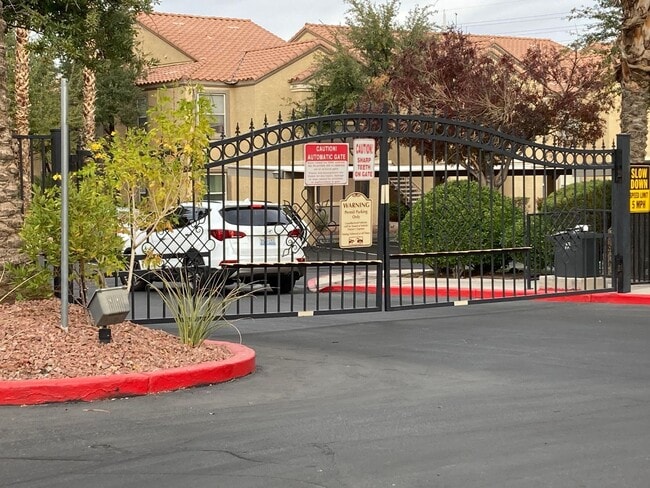 Building Photo - Gated community just minutes south of the strip, 2br/2bath, 2nd floor condo.