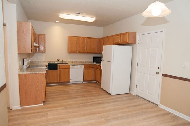 Building Photo - Updated and Bright 2B/2B with Attached Garage Now Available!