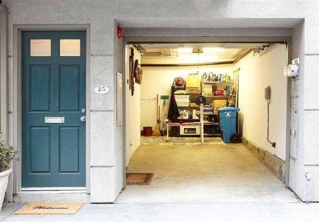 1st Floor: Garage with interior access to stairs. - 25 Jennifer Pl