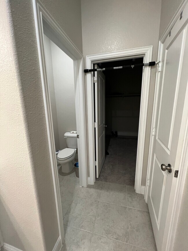 Master bathroom/closet - 1610 Charismatic Ct