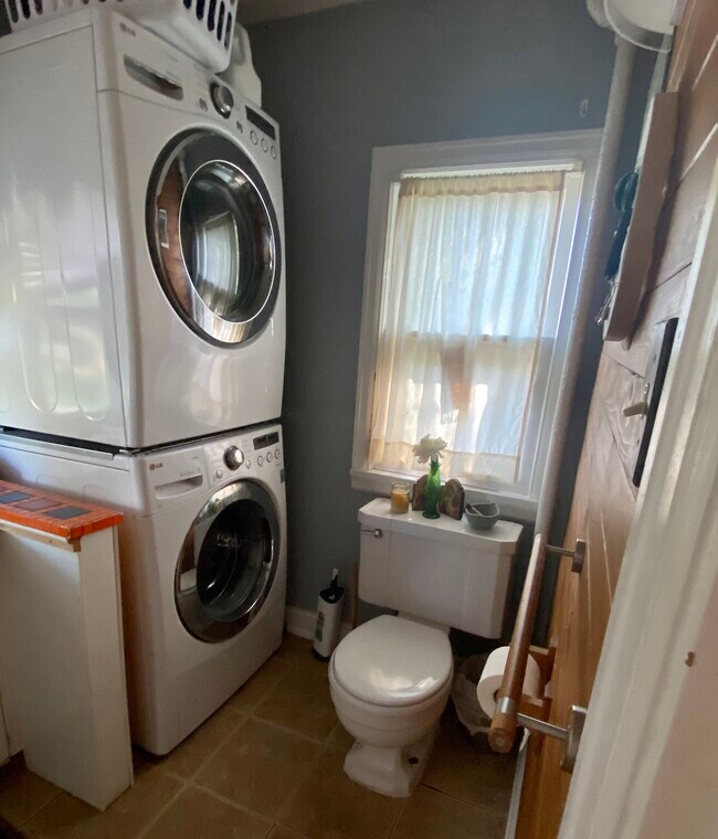 Bathroom w/ washer/dryer set up, photo prior to sink remodel - 1301 E 7th St