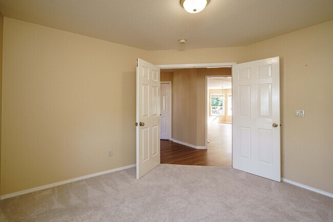 Building Photo - Beautifully Landscaped 1/4 acre with Well Maintained 4 bedroom 2 Bath Home with 3 Car Garage