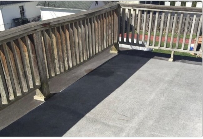 Private Balcony Overlooking backyard and tree-lined neighborhood. - 61 Hirschfield Dr