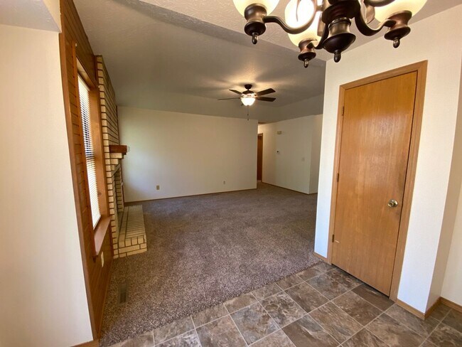 Building Photo - Three bedroom, two bathroom, two car garag...