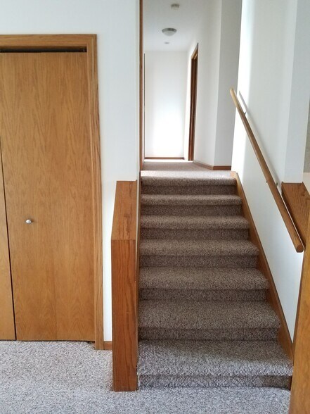 Stairs leading to badrooms/bathrooms - 1010 N Gammon Rd