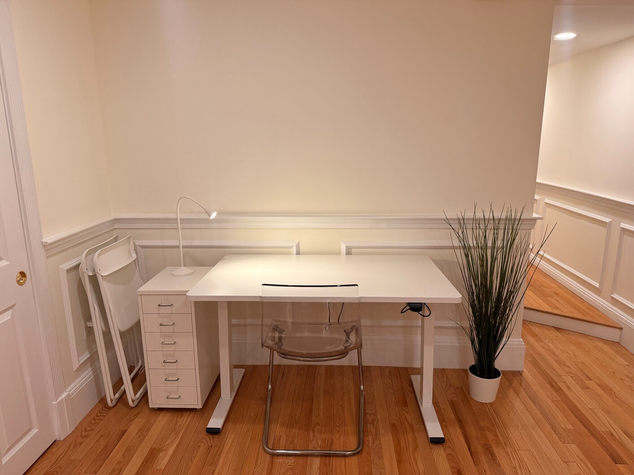 living area - adjustable sit stand desk and storage - 382 Riverway St