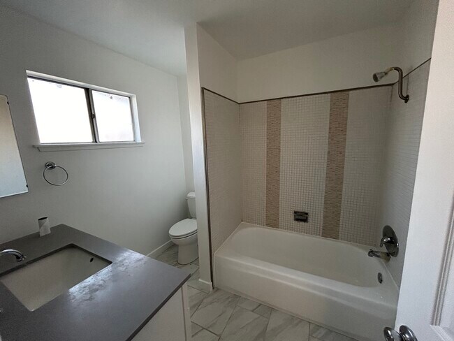 With sink, bathtub, and shower - 11690 Kismet Ave
