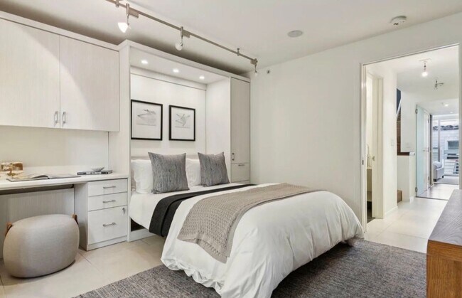 Building Photo - One-of-a-Kind Sophisticated Top-Floor Cond...