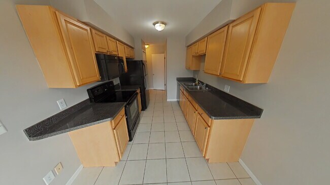 Building Photo - "2-Bed Condo Retreat in Clinton Township – Cozy Comfort Awaits!"