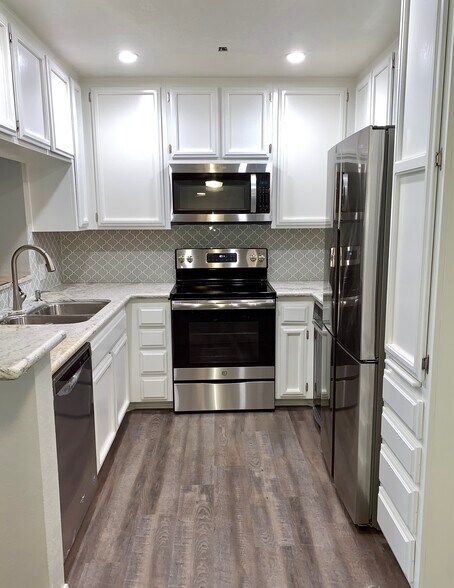 Kitchen from dining space - 5665 Friars Rd