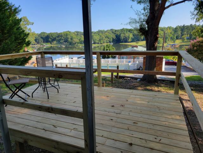 Attached deck overlooking lake - 106 Mountain Shore Dr