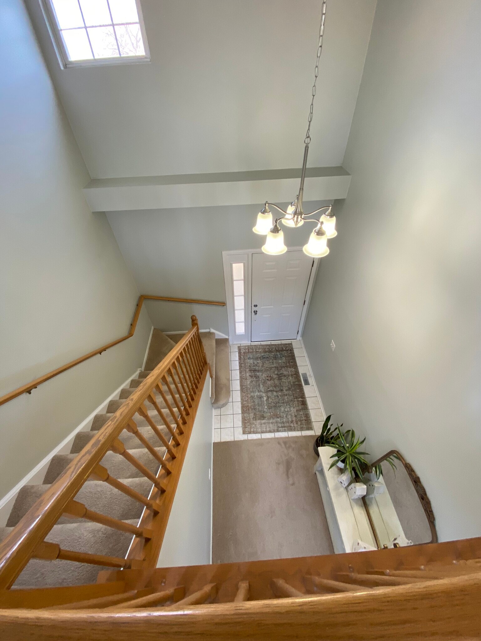 Stairs down to foyer - 344 S Lancelot Ln