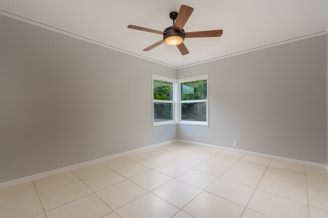 Master bedroom has view onto backyard greenery - 211 Farview Drive