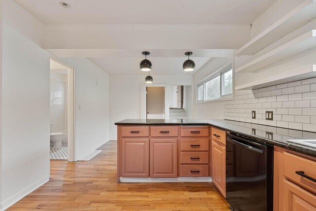 Building Photo - Beautiful, modern 4-bdrm/2-bath home in Concordia—Private, urban sanctuary w/ flex spaces