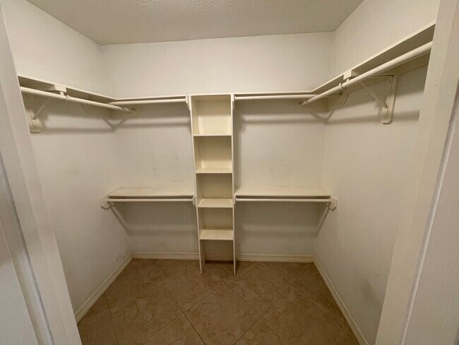 Walk in closet in master bedroom - 600 River Bend Dr