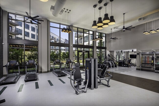 Our spacious fitness center offers a variety of equipment to meet your needs. - 565 Hank by Windsor