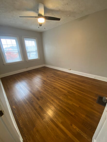 Bedroom with 2 closets and ceiling fan. - 136 Fairfield Ave