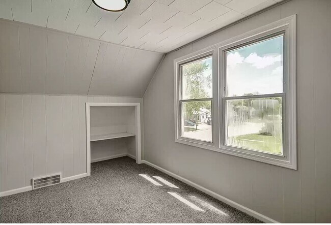 Upper bedroom 2 with new carpet and lighting - 743 Marie Ave